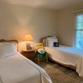 Bedroom 3 has 2 twin beds, plus a TV.